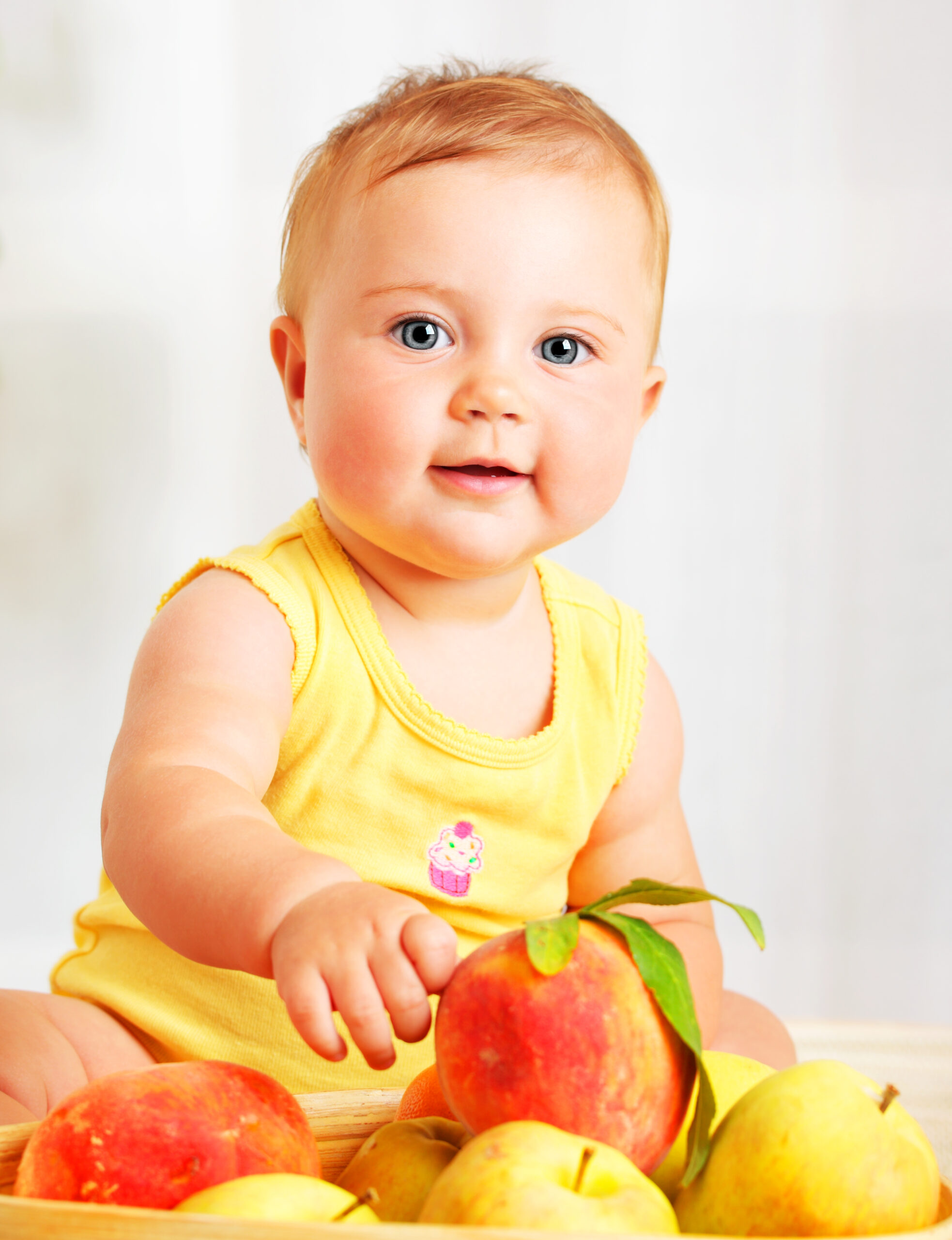 Baby girl choosing fruit